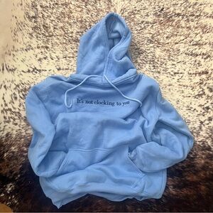 Light Blue Hoodie “It’s not clocking to you”